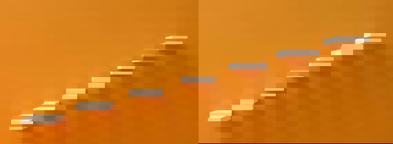 Stylised image of steps going up an orange wall